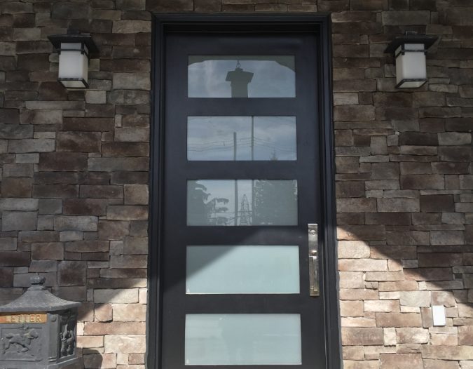 modern fiberglass door-sandblasted glass-fieldstone windows doorsmarkham