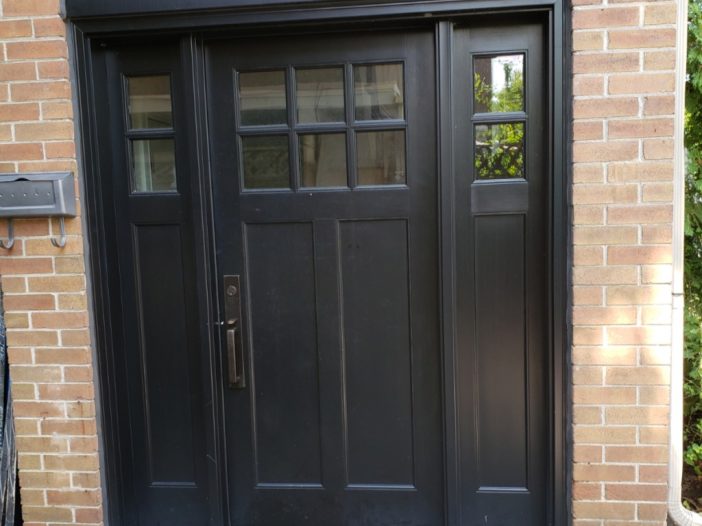 Black fiberglass craftsman style entry door