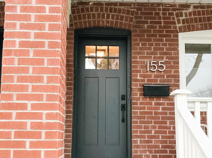 black craftsman style entry door