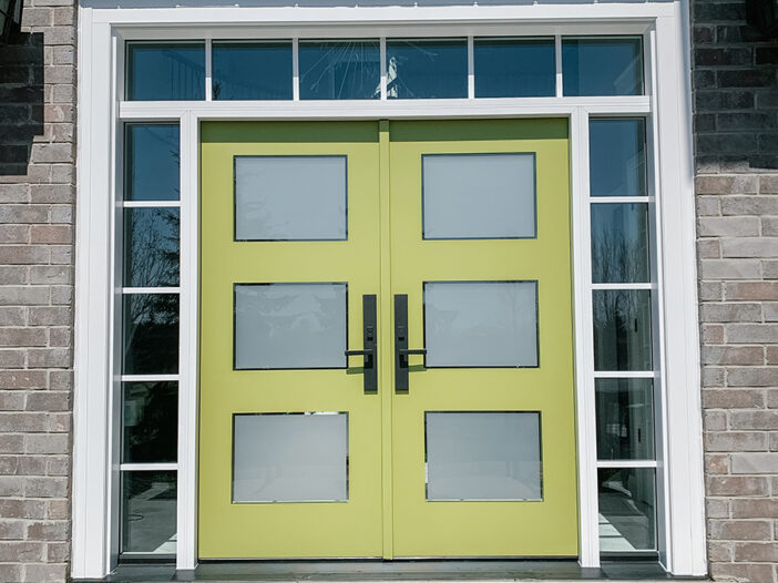 3-panel glass fiberglass front door with sidelights installed in a Toronto home