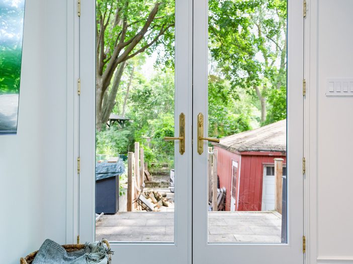 white fiberglass rail and stile double doors