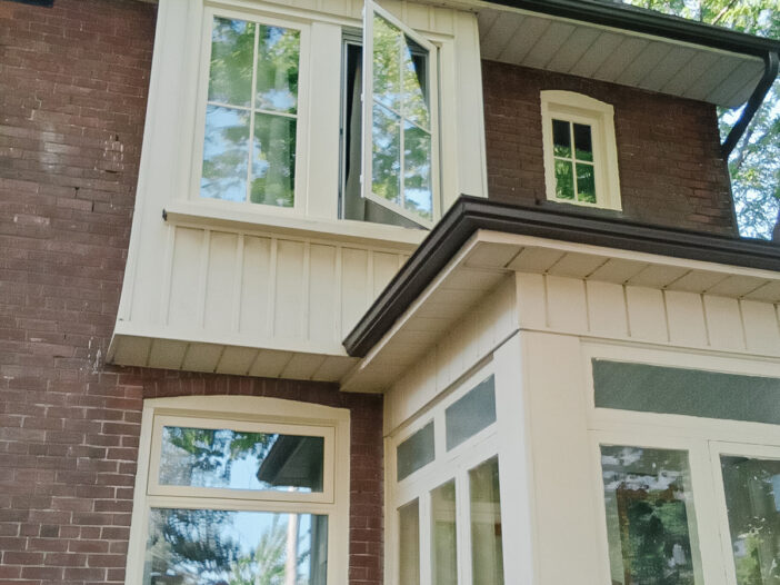 Vinyl casement windows with SDL grilles installed in a Toronto home