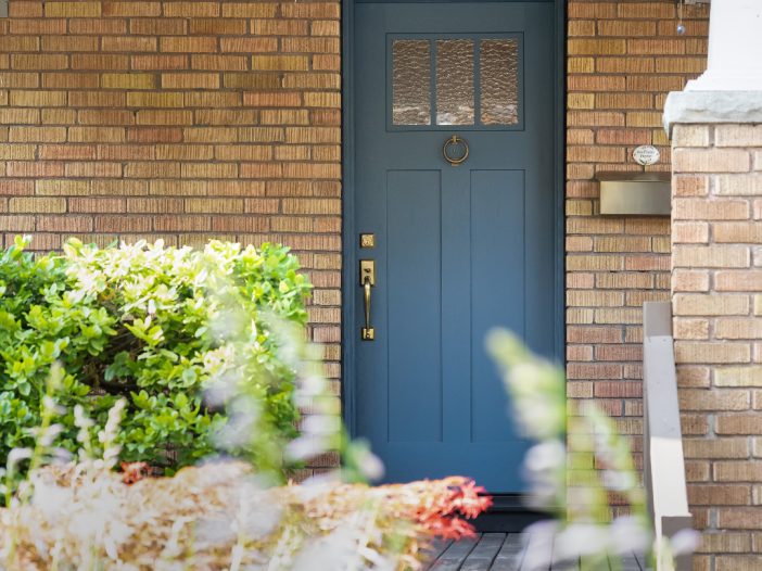 fiberglass craftsman style door with two vertical shaker panels exterior