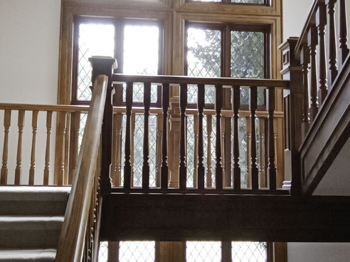 Tall fixed and casement window combination with leaded tape in a Markham home