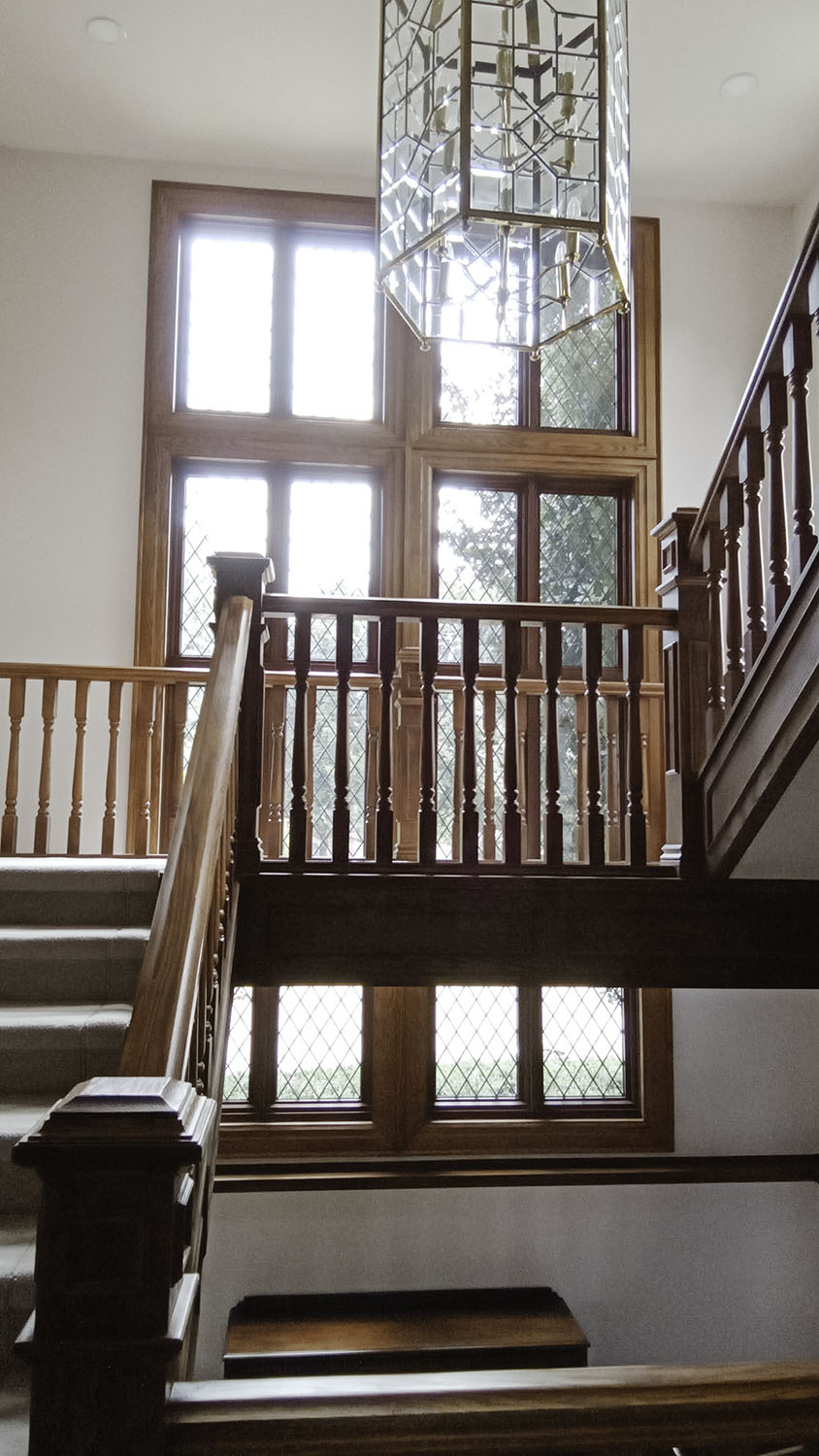 tall fixed casement window combination with leaded tape - stairs