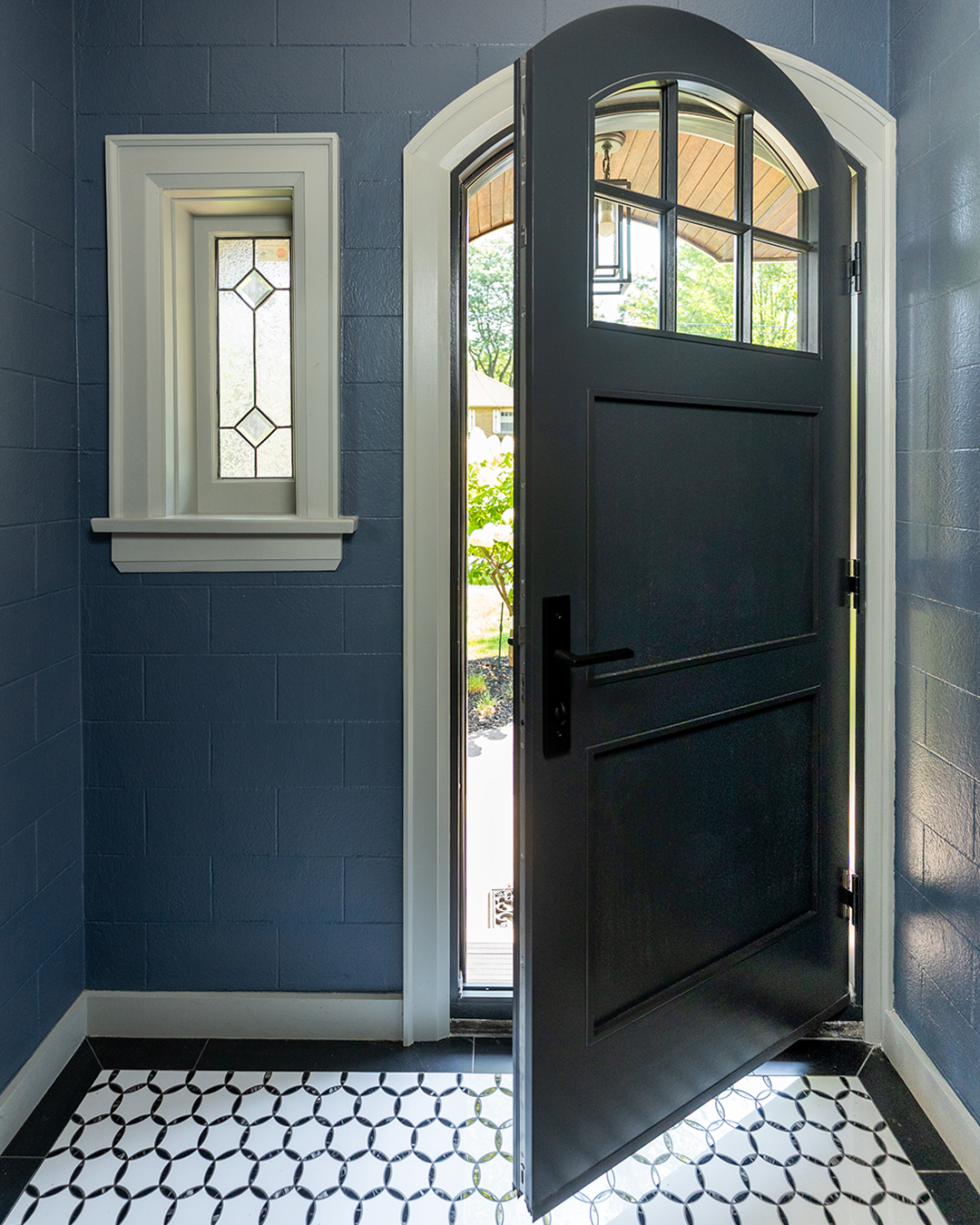arched metal clad wood front door - open interior