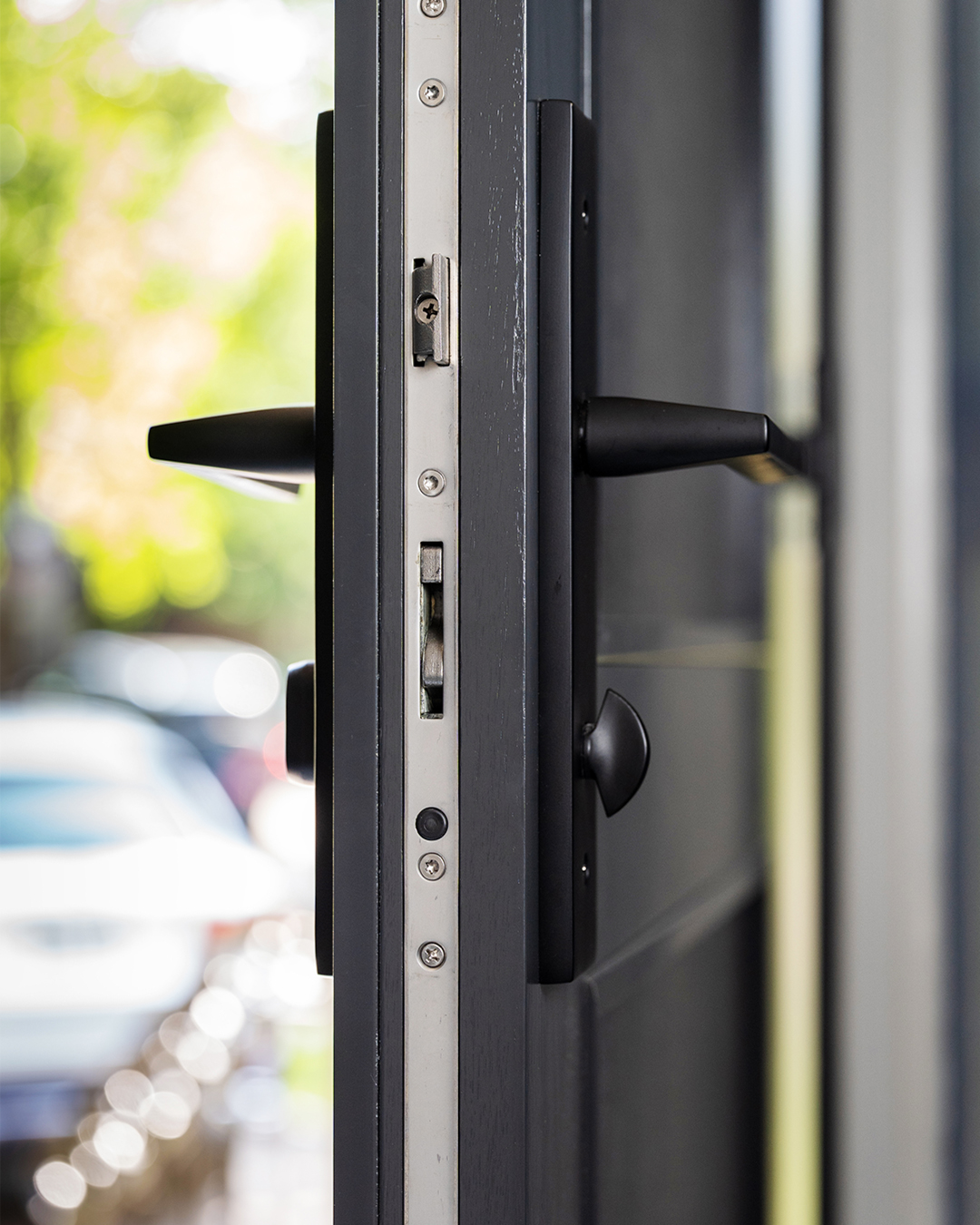 arched metal clad wood front door - hardware latch