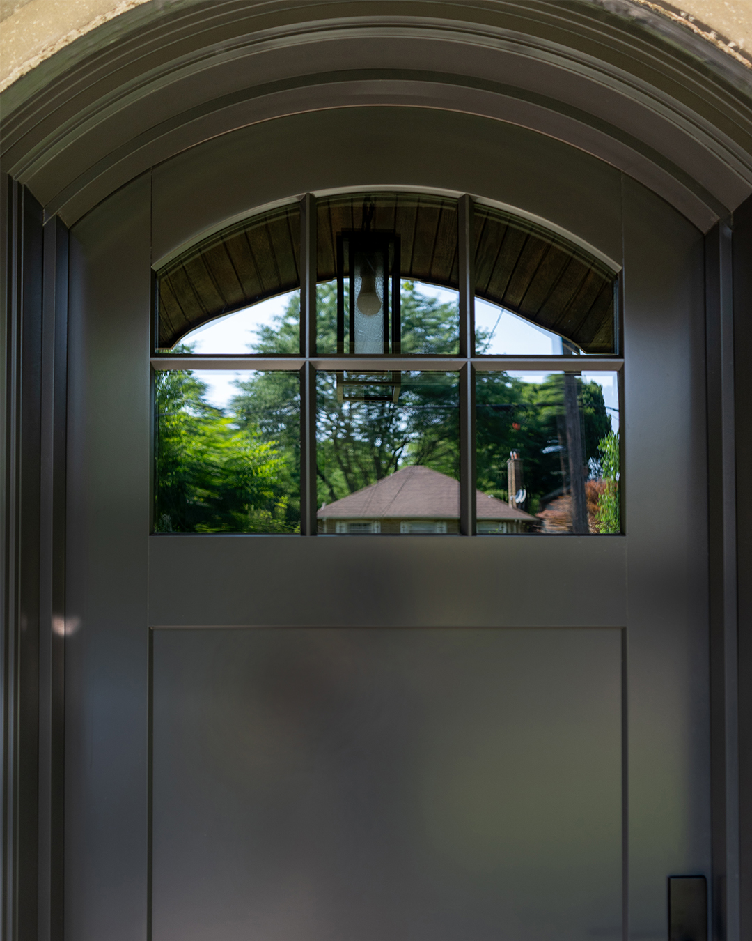 arched metal clad wood front door - close up