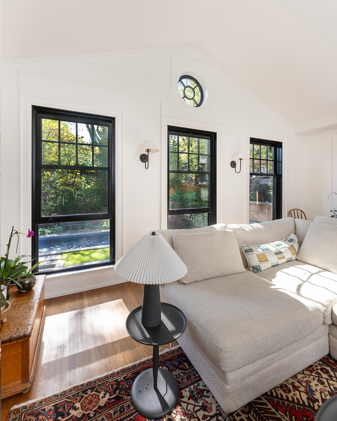 black single hung metal clad windows - near sofa