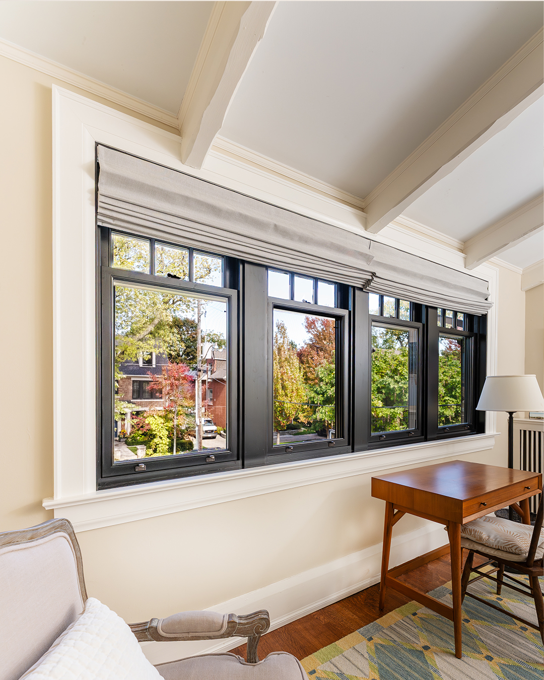 black single hung metal clad windows - near desk