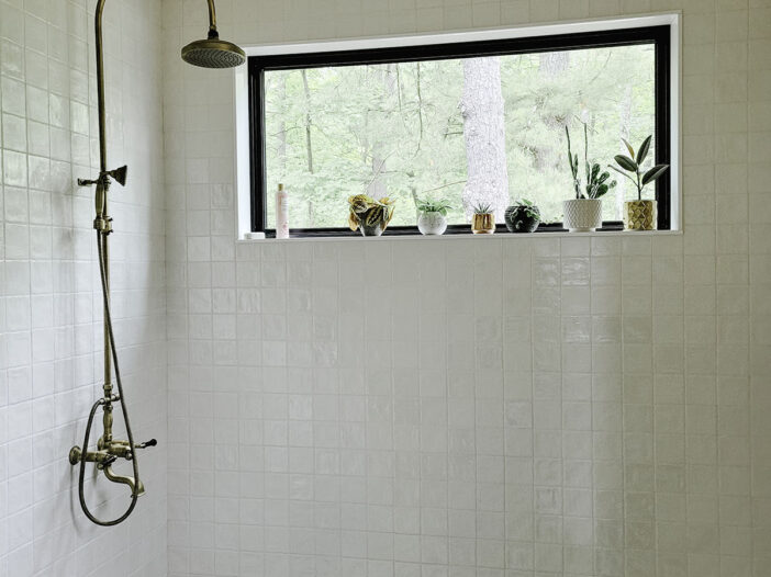 Fixed bathroom window bringing natural light into a Muskoka cottage bathroom.