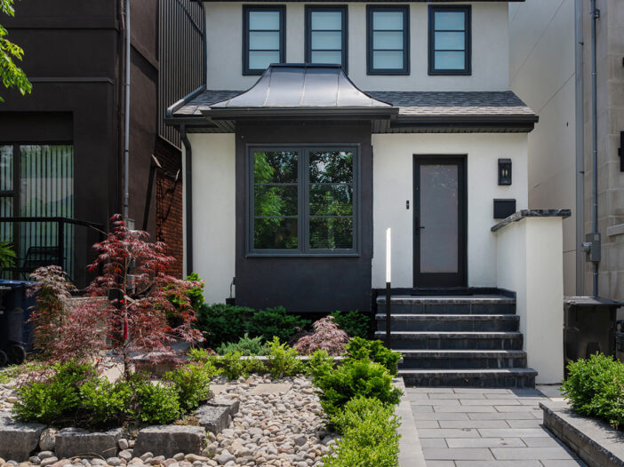 Iron Ore finish casement windows installed on the front exterior of a Toronto home