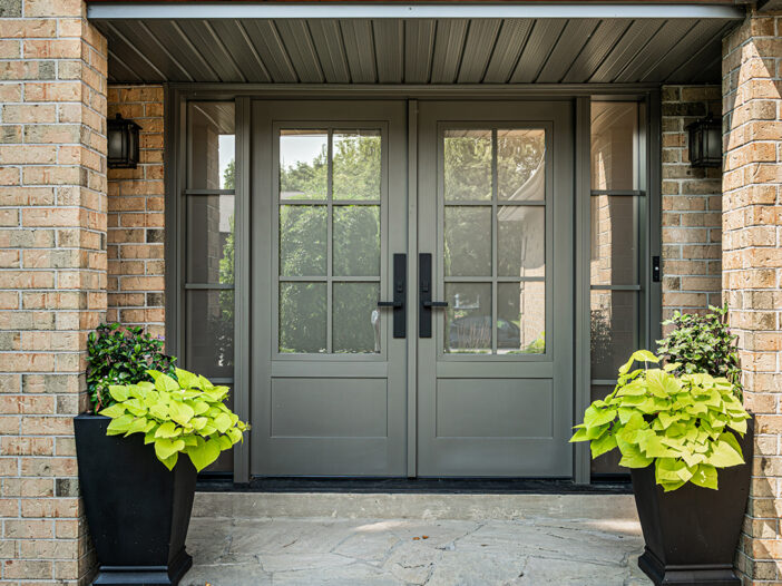 Front exterior of Aurora home featuring a Gentek Sable fiberglass double door with sidelights