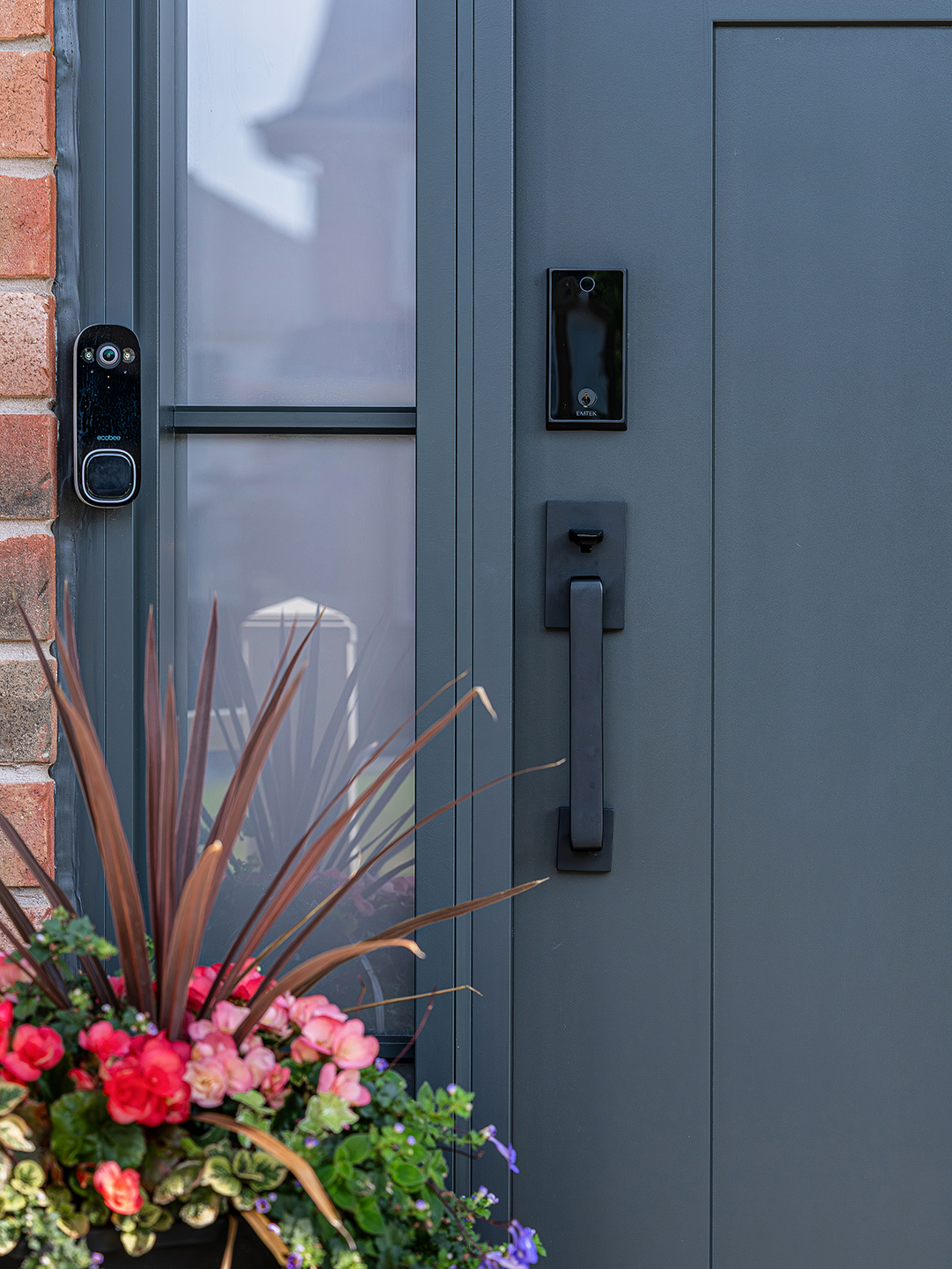 Close-up view of Craftsman front door with sidelights in Stouffville