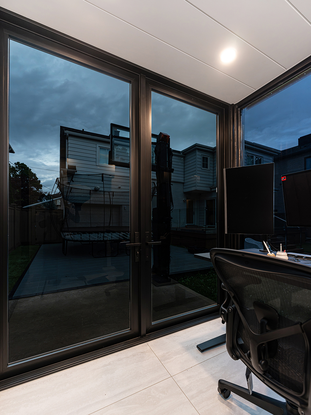 Interior view of the container office showcasing a modern workspace with minimalist furniture and natural lighting.