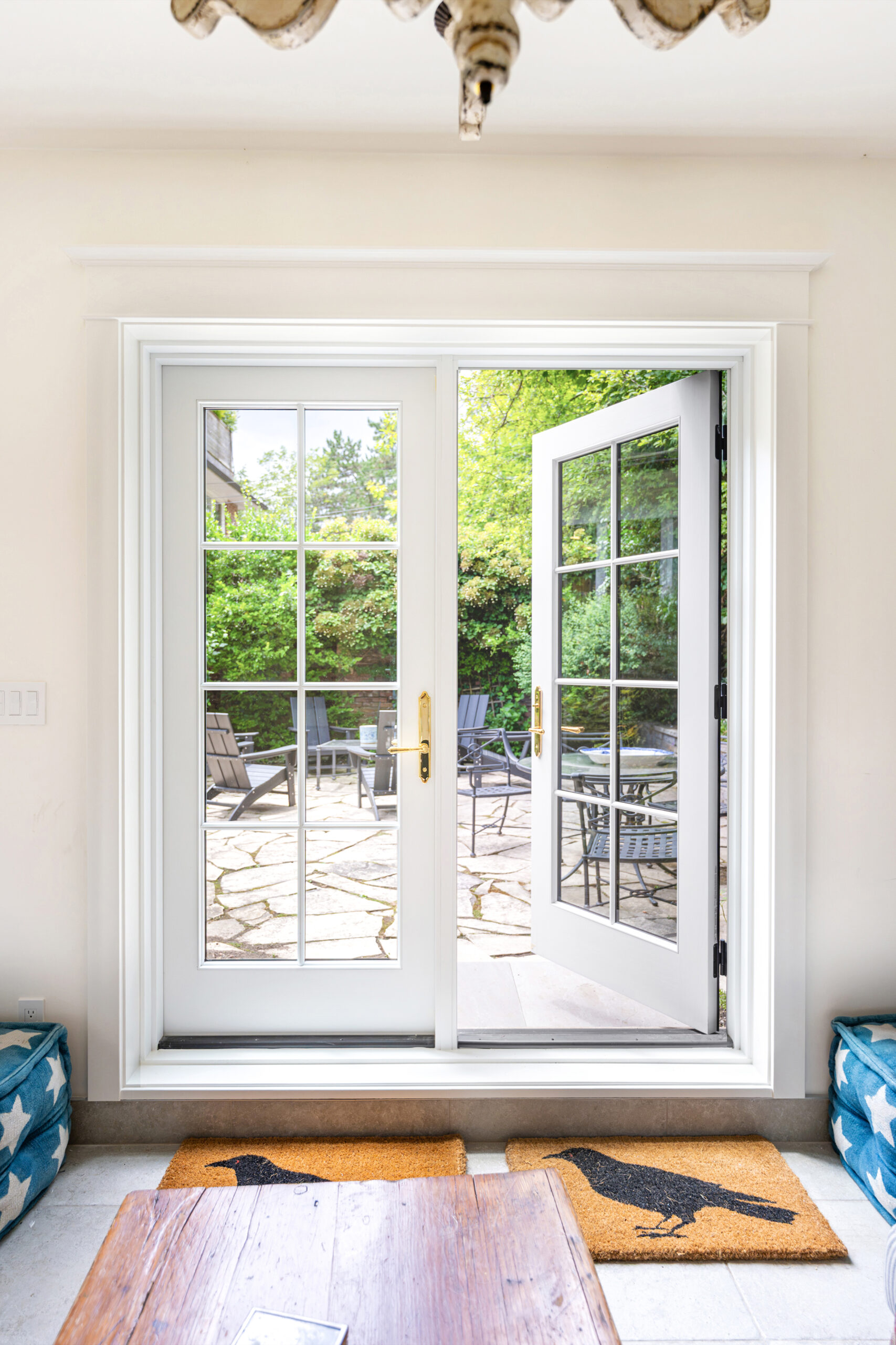 Open Red Grandis wood French doors viewed from inside garden studio.