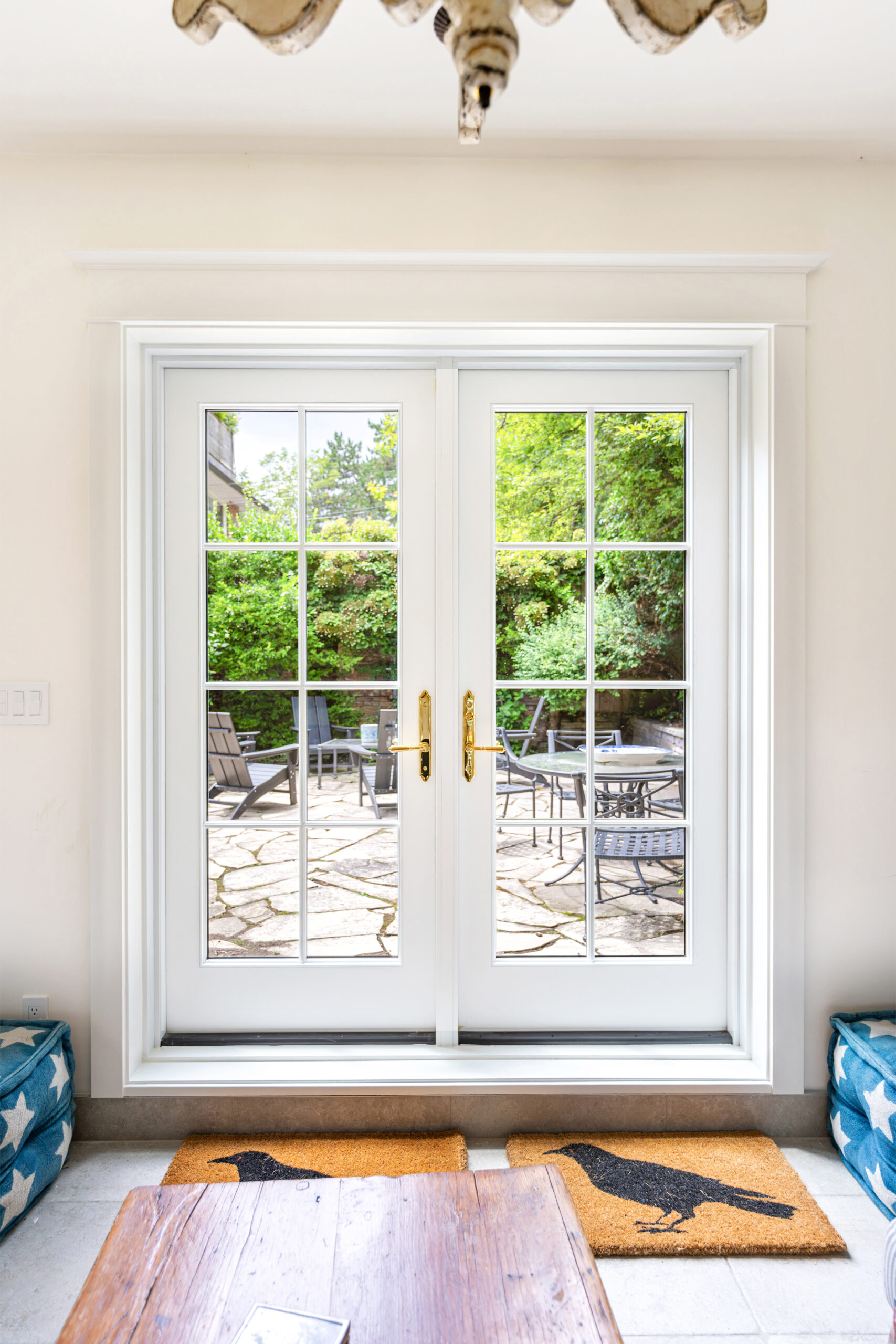 Interior view of Red Grandis wood French doors in Toronto garden studio.