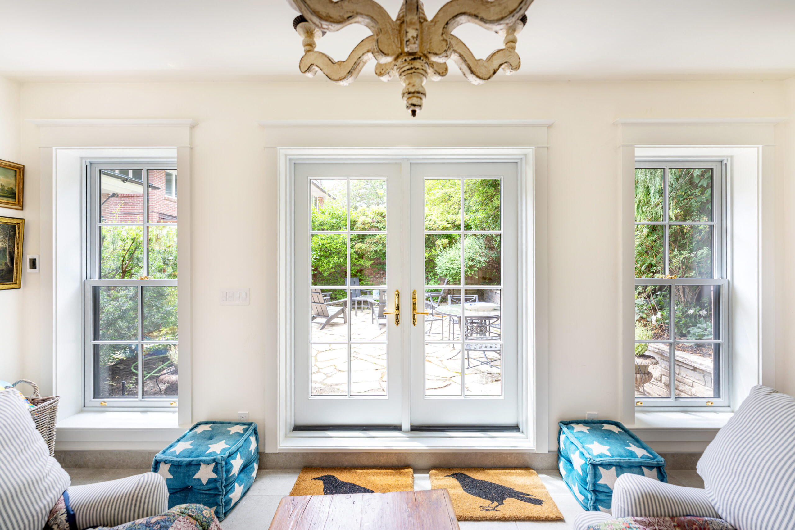 Full interior view of wood French hinged doors in garden studio.
