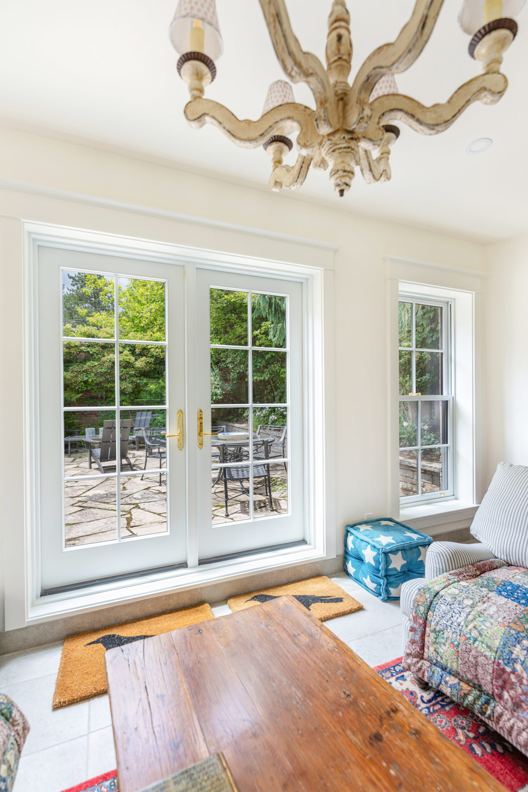 Angled interior view of Red Grandis French doors in garden studio.